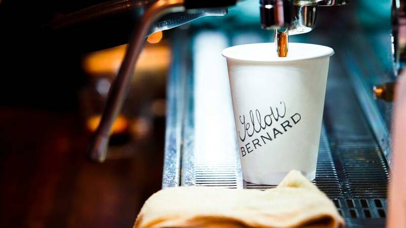 Yellow Bernard serve up cups of hot coffee to eagerly-awaiting coffee lovers