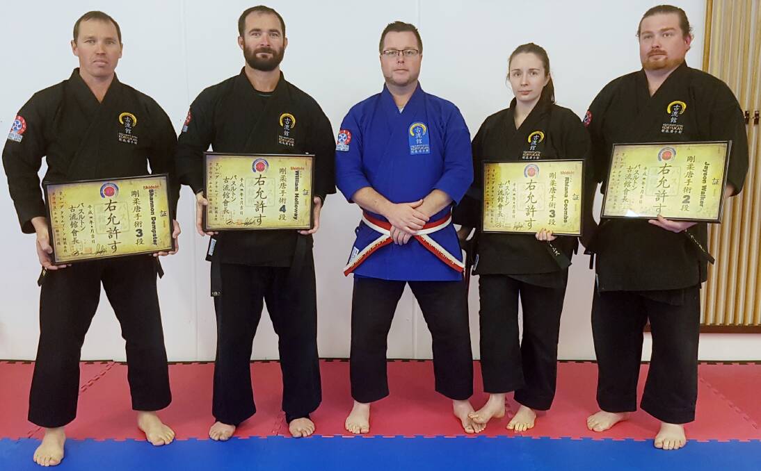Busselton Martial Arts chief instructor Craig Crampton Shihan fifth dan (centre) with students Shannon Dempster third dan, William Holloway fourth dan, Rhiana Coombs third dan and Jayson Walker second dan on grading day.