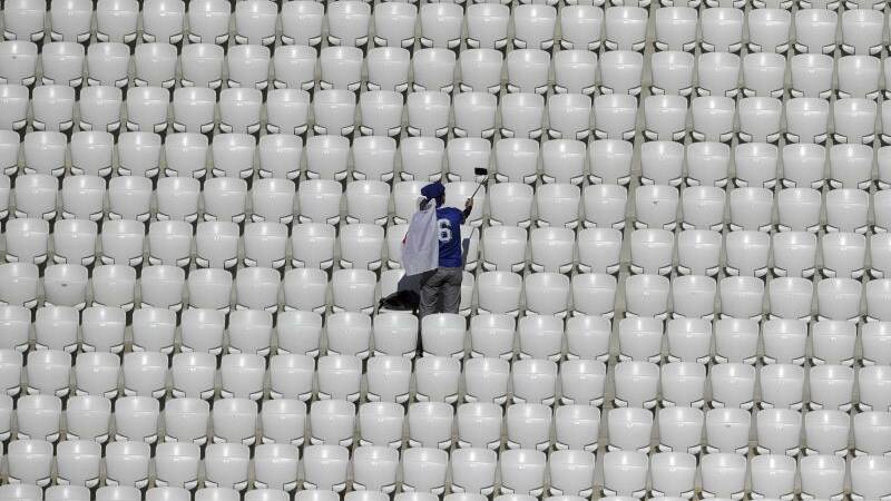 A supporter of Japan takes a selfie on the stands before the group H match between Japan and Poland. Photo: AP Photo/Themba Hadebe