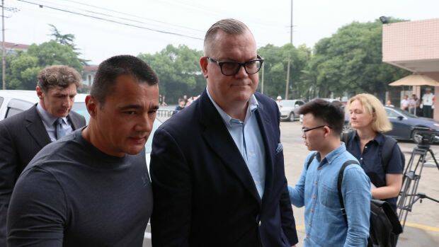 Jeff Sikima, centre, the husband of Jenny Jiang, who had arranged visas for Crown clients and was one of only three defendants on bail. Photo: Sanghee Liu