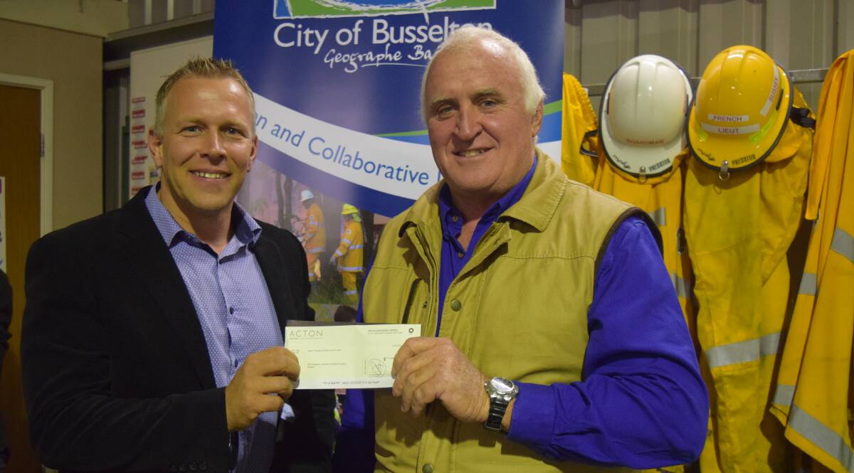 Acton Busselton director Jason Dragstra and City of Busselton chief bushfire control officer Allan Guthrie with a donation for the volunteers' hardship fund.