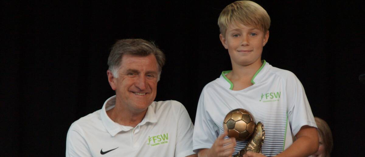 Football Federation South West coach Peter McClurg with player Jack Anderson who received a talent and effort trophy at the inaugural presentation night held in Busselton.