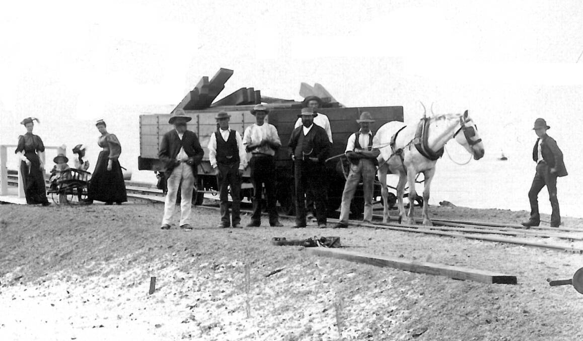 The image is a reproduction of a very early photograph of timber being transported along the Busselton Jetty in the 1890s. Photo supplied by the City of Busselton.