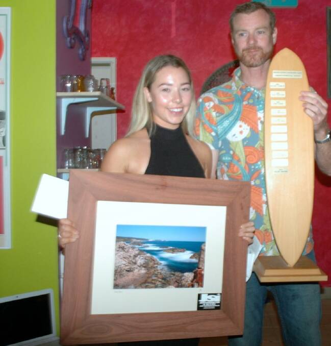 Junior winner Chelsea Bedford was presented with her title by Indian Ocean Longboard Club president Andrew Bland. She received a wetsuit along with a trophy for her troubles.