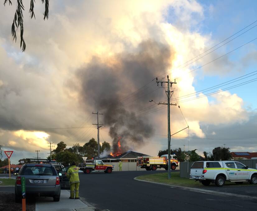 Flames engulf a house on Seymour Street in West Busselton yesterday.