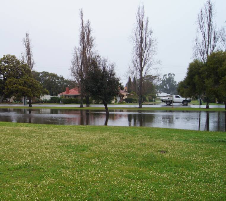 The side of the road turned into a lake as mass flooding took over parts of Busselton's streets and parks. Photo by Lily Yeang. 