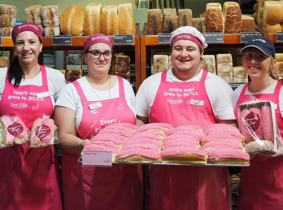 Busselton Bakers Delight's Candy Paxton, Katie Ridley, Corin Remnant and Leanne Beattie have been selling pink buns to raise money for Breast Cancer Network Australia.