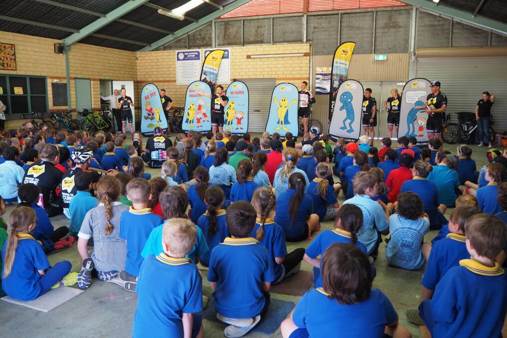 Busselton Primary School students listening to the Tour de Cure team. 