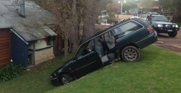 Yallingup locals are puzzled as to how the car ended up down the steep embankment. Photos supplied.