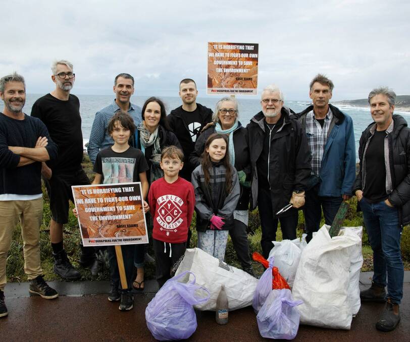 Christian Fletcher (far right) and a group at Sugarloaf Rock last year for the inaugural Photographers for the Environment Photo Site Clean Up Day. Photo supplied.