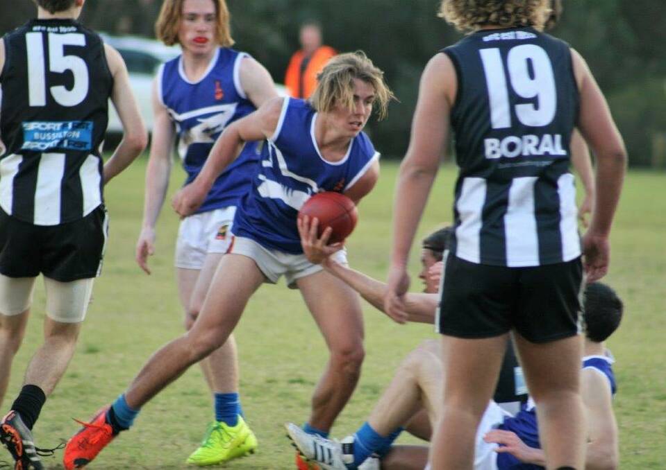 Two of the Sharks' best on ground players were Liam Green (handballing) and Cooper Stubbs (looking on), as well as Lucas Dean and Jessie Pes. 