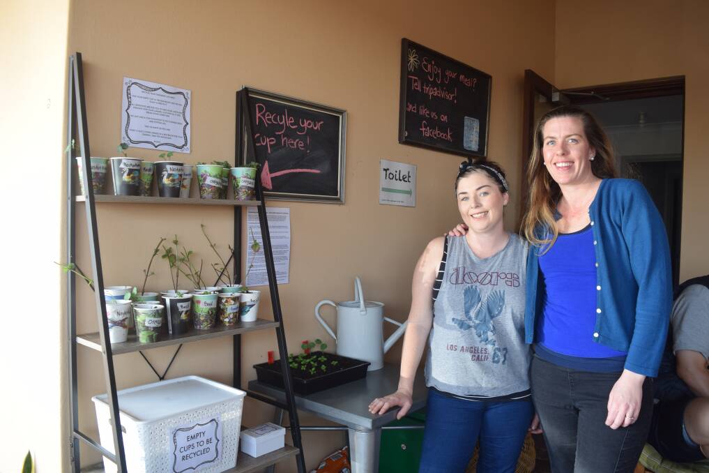 Urban Coffee House owner Rheannan Sweeney and staff member Jasmine Don at the takeaway cup recycling station. 