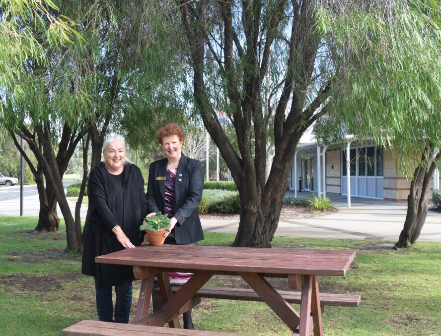 Judith Murray and GMAS vice-principal Jo Burns with the primrose. 