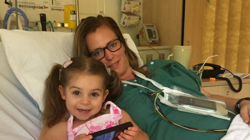 Millbridge mother Felicity McQueen was diagnosed with atrial fibrillation after noticing a regularly high heart rate on her Fitbit. She is pictured with her daughter Olivia.
