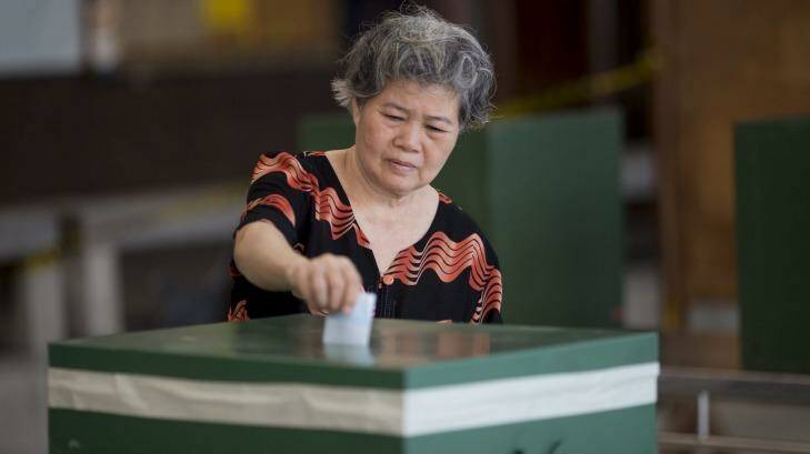 A voter casts a ballot in Bangkok. Photo: Brent Lewin