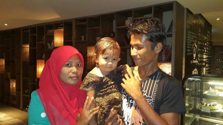 Ali yasmin with his wife: Baualan (just the one name) and his 18-month-old?? daughter?? Aisah Nuruna