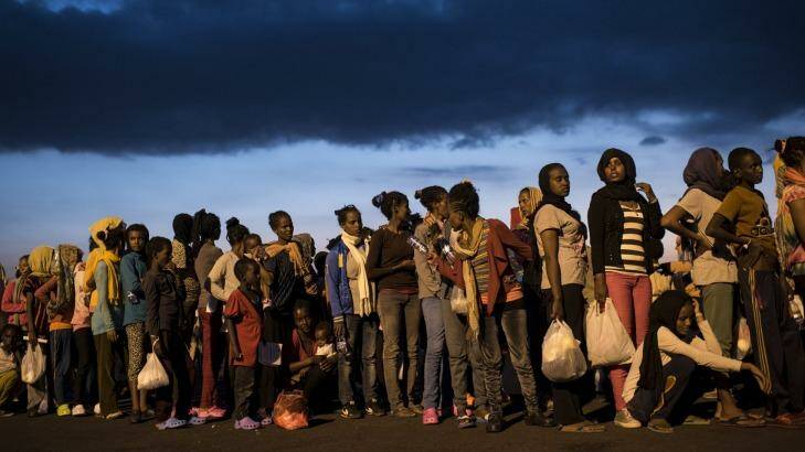 Fleeing multitudes: Hundreds of migrants from sub-Saharan Africa arrive at Augusta port in Sicily in September.  Photo: New York Times