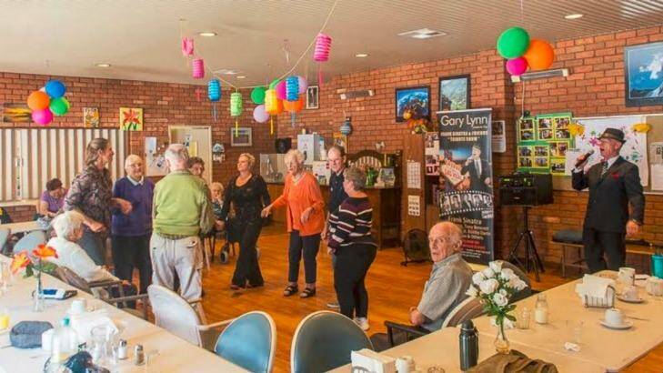 Local elderly residents enjoy a Gary Lynn performance at the Willagee Community Centre.  Photo: Tom de Souza