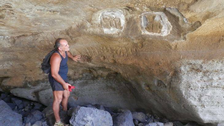 Rock drawings done by Polynesians who lived on Pitcairn Island centuries ago has been seen by very few visitors. Photo: Craig Tansley