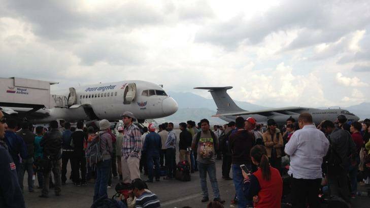 People are anxiously waiting at Kathmandu airport to catch a flight out of the quake-ravaged country. Photo: Yvonne Renshaw