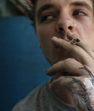 Bryn Parkinson with a tattoo of a tree that runs down his left arm.  Photo: Nic Walker
