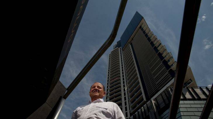 Mario Salvo from the Salvo Property Group in front of one of his developments - The Bank Apartments in Southbank, Melbourne. Photo: Jesse Marlow