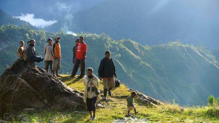 Men gather to talk in the remote highlands village of Lolat. Photo: Michael Bachelard