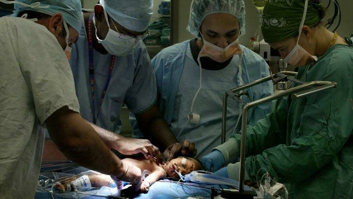 Doctors at the Royal Childrens Hospital, Randwick, Sydney, prepare a baby for heart surgery in 2006. Photo: Kate Geraghty