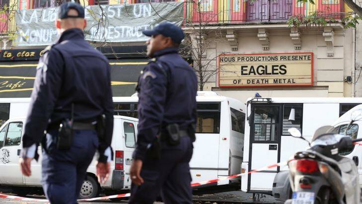 Police patrol Boulevade Voltaire in front of the Bataclan concert hall where the Eagles of Death Metal played last Friday night. Photo: Andrew Meares