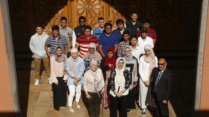 Malek Fahd School students pose for a picture with School Principal Aiyub Ahmed and teachers Tulin Bragg and Houda Kabbr. Photo: Daniel Munoz