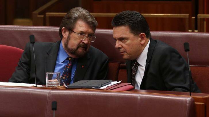 Senators Derryn Hinch and Nick Xenophon as midnight approaches in the Senate at Parliament House in Canberra on Tuesday. Photo: Andrew Meares