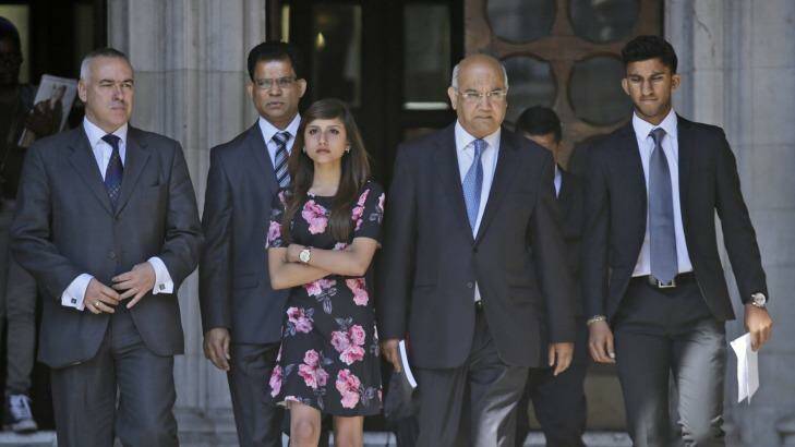 Labour MP Keith Vaz, center, walks away with late nurse Jacintha Saldanha's family, including her husband Benedict Barboza, second left, her daughter Lisha, 3rd left,  and her son Junal, right, following an inquest into her death at the Royal Courts of Justice, in central London Photo: Lefteris Pitarakis