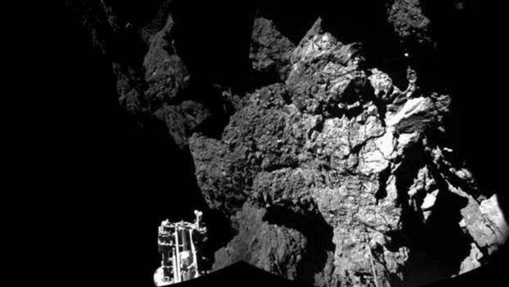 First contact: The first image of the comet's surface taken by Rosetta's lander Philae. One of the lander's three feet can be seen in the foreground. Photo: ESA