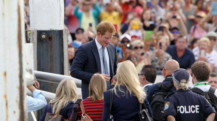Prince Harry greets the crowd at Campbell's Cove, Sydney, during his 2013 visit. Photo: Janie Barrett 