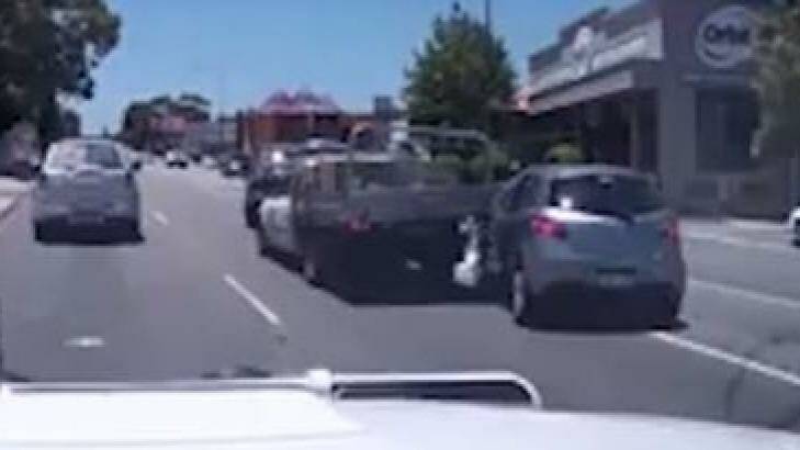 The car scrapes the side of the ute in a last minute swerve. Photo: Dash Cam Owners Australia