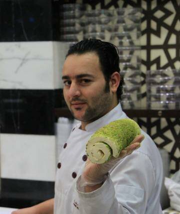 Even watching the chef prepare Syrian ice-cream, or booza, at Damascus Sweets is an experience. Photo: Ben Groundwater