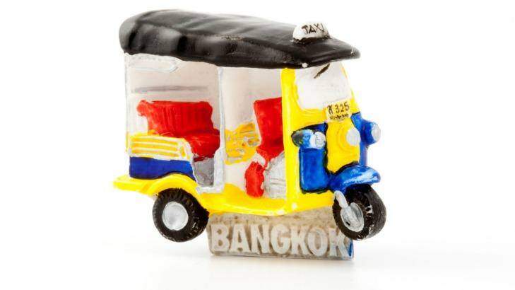 Bangkok souvenir fridge magnet of a tuk-tuk.  Photo: Alamy 