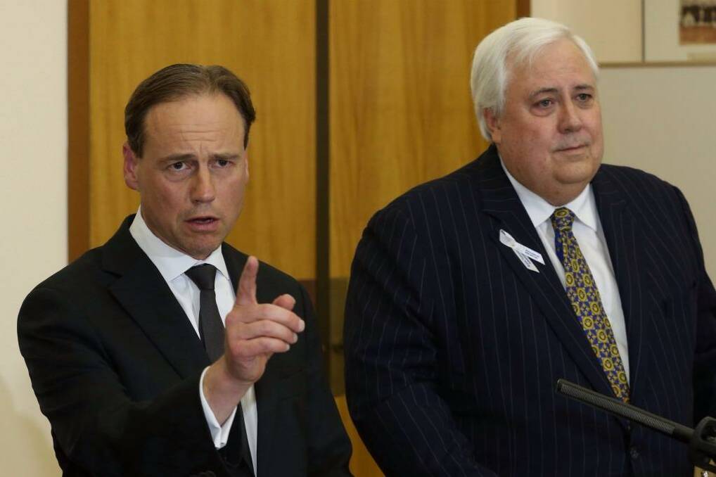Clive Palmer and Environment Minister Greg Hunt during a press conference at Parliament House in Canberra on Wednesday. Photo: Andrew Meares