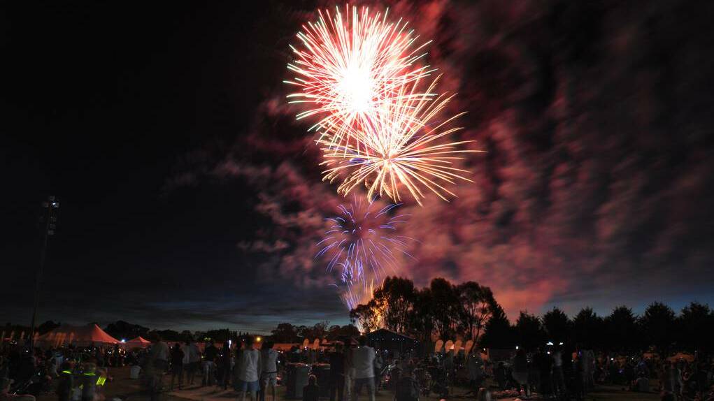 ORANGE: Fireworks light up the Orange skyline. Photo: STEVE GOSCH