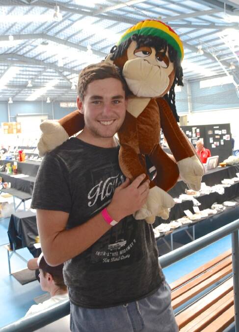 Dylan Sexton with the new friend he found at sideshow alley. Photo: Megan Simmonds.