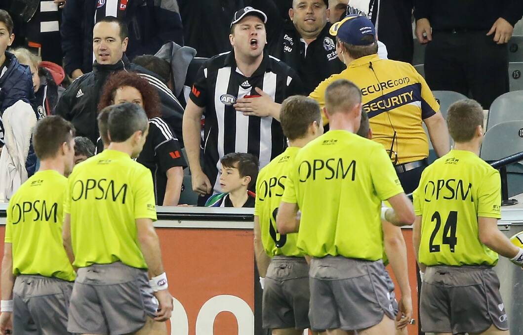 A Magpies fan abuses the umpires during the round 10 AFL match between the Collingwood Magpies and West Coast Eagles at Melbourne Cricket Ground on May 24, 2014. Photo: Getty Images.