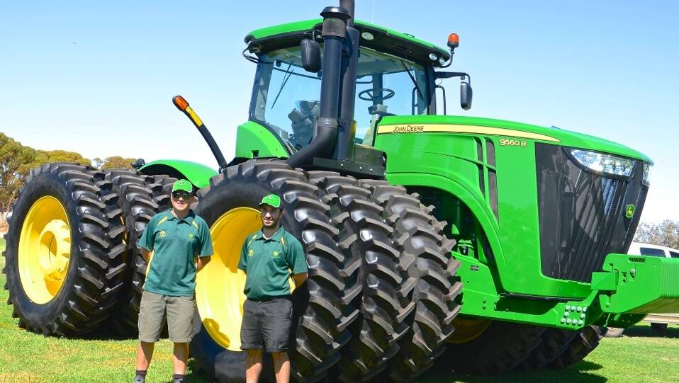 Ag Implements’ Matthew Musca and Colin Goodwin with a John Deere tractor. Photo: Megan Simmonds.