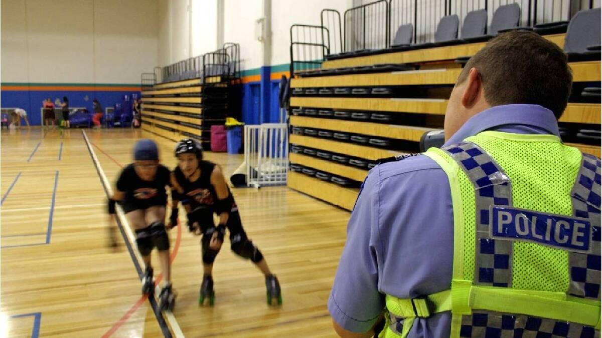 South West Traffic acting officer-in-charge Sergeant Robert Malcolm timing Bunbury Roller Derby skaters Amber 'Maykinu Bleed' King and Cathryne '2Katty' McDonagh. Photo: Andrew Elstermann/Bunbury Mail. 