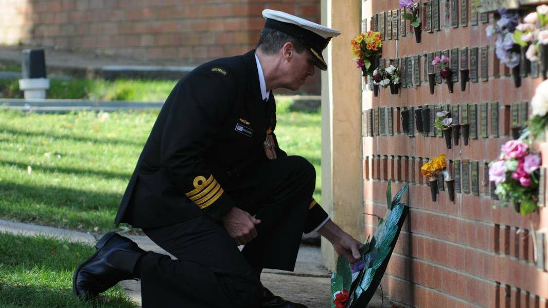 ORANGE: A wreath is laid at the memorial wall at Lone Pine. Photo: Steve Gosch, Central Western Daily.