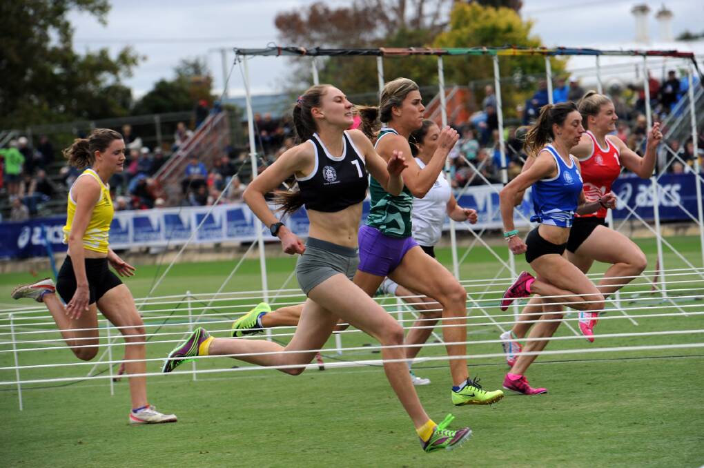 Tiffany Boatman, Crowlands, in black, wins heat 12, in the Stawell Strickland Family Women's Gift. 