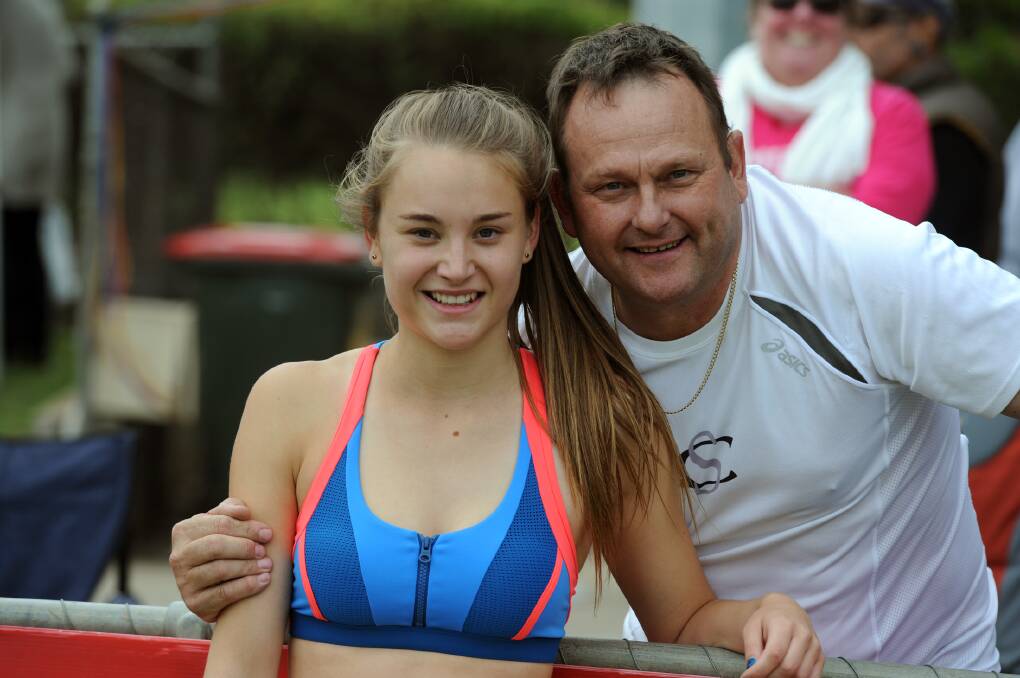 Sarah Blizzard, Ararat, with her dad Neil, after winning her heat in the Stawell Strickland Family Women's Gift 