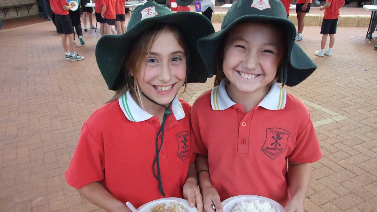 St Joseph’s School students Jessica Hill and Meg Olden with their rice