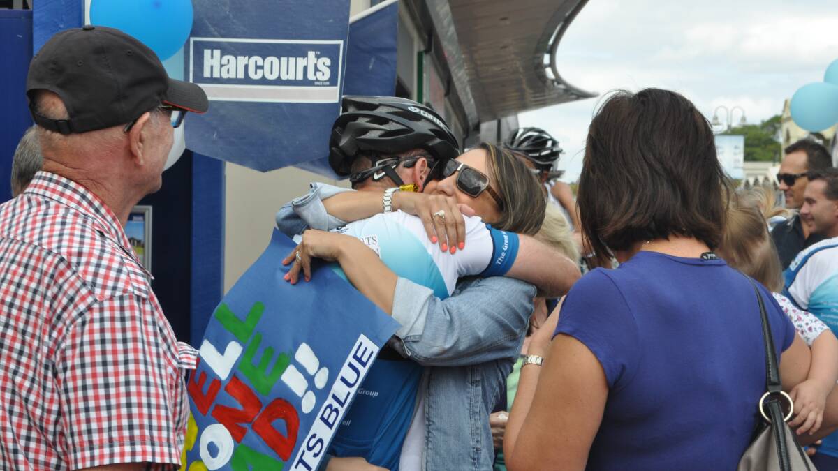 An emotional greeting for one of the cyclists 