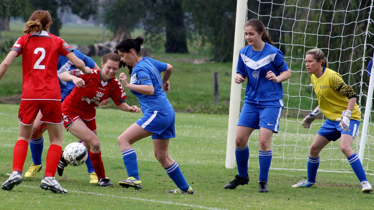 Geographe Bay Seasiders girls survive a goal-mouth scramble against Busselton.
