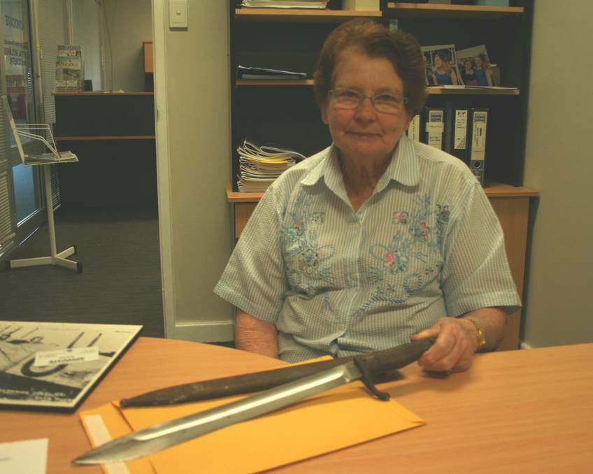 Moora Historical Society President Kaye Lewis with the World War I bayonet she found in her pantry. 